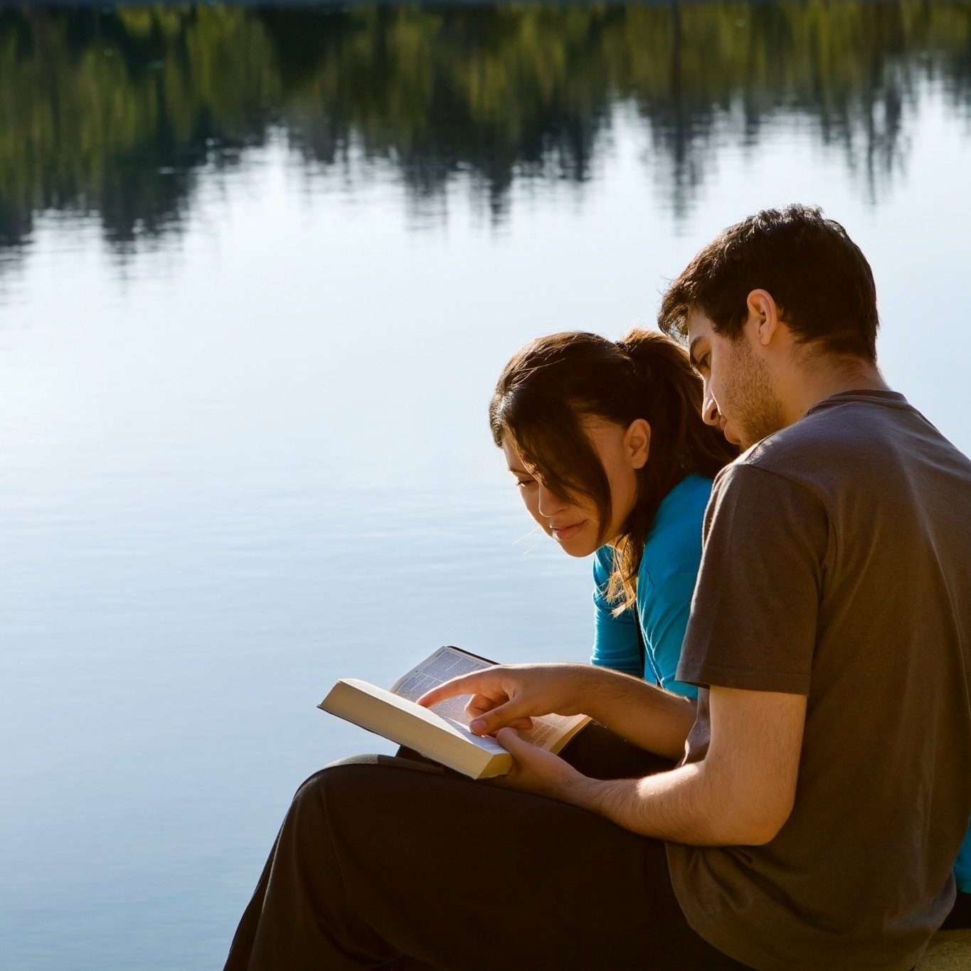 bigstock-Couple-Reading-The-Bible-By-A--45274390